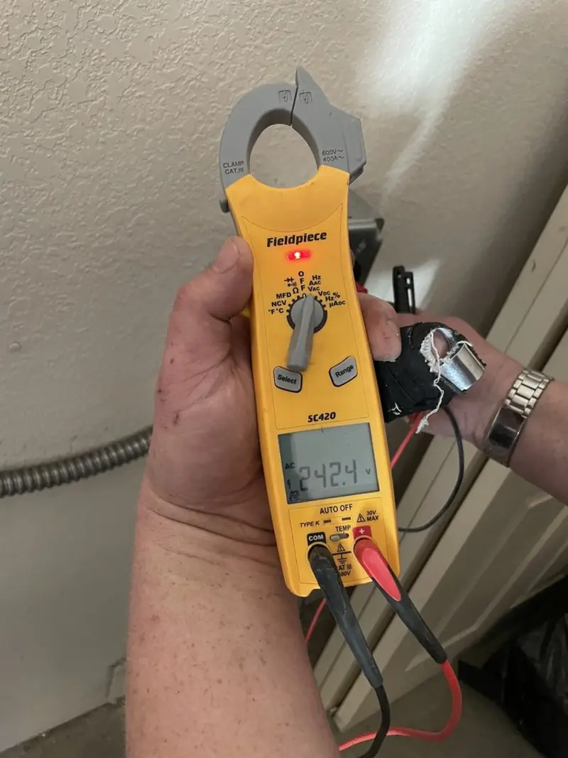 Voltage testing with clamp meter during Hot Tub / Pool Electrical Wiring in Woodson Terrace